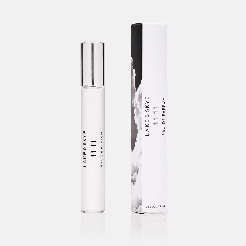 Bottle of lake & skye 11 11 eau de parfum next to its packaging.